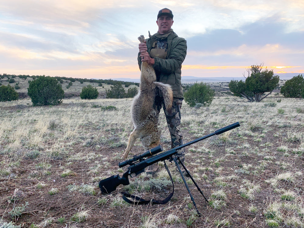 Hunter using a ROKSTEDi bipod for coyote hunting in the field